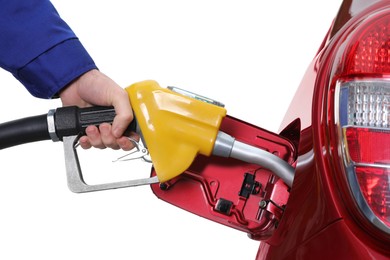 Photo of Worker filling up car with fuel on white background, closeup. Gas station