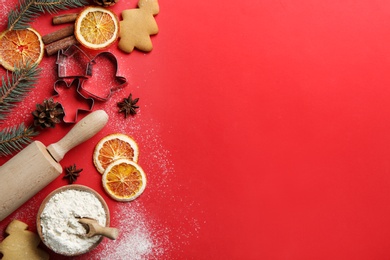 Photo of Flat lay composition with Christmas decor and flour on red background,. Space for text