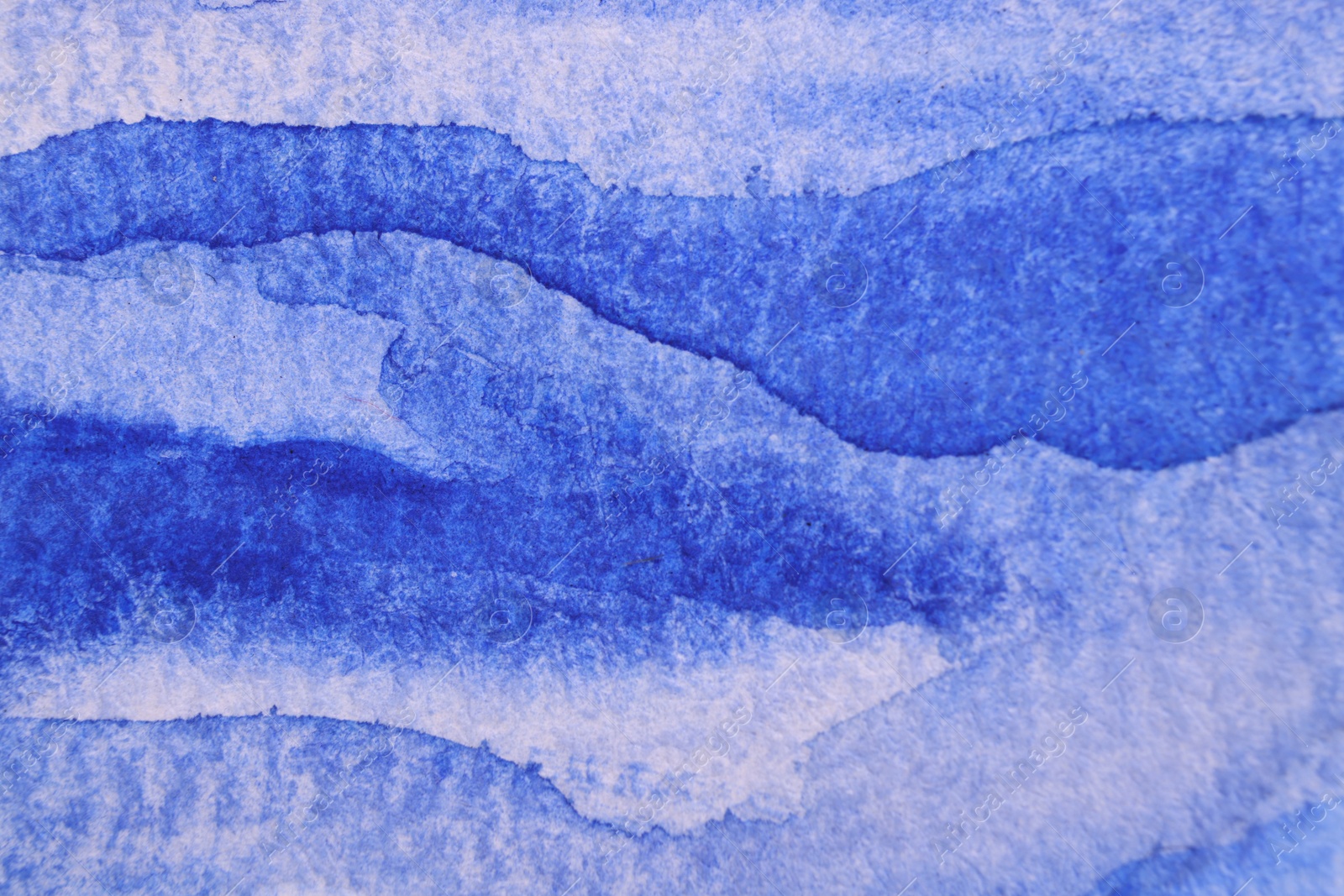 Photo of Abstract blue watercolor painting as background, top view