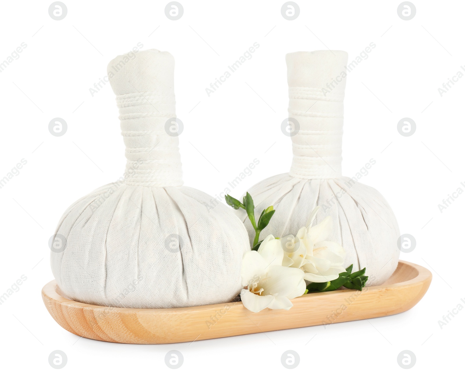 Photo of Herbal massage bags and flowers on white background. Spa procedure