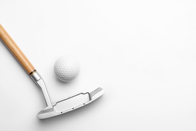 Golf ball and club on white background. Sport equipment