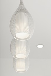 White modern lighting on ceiling in room