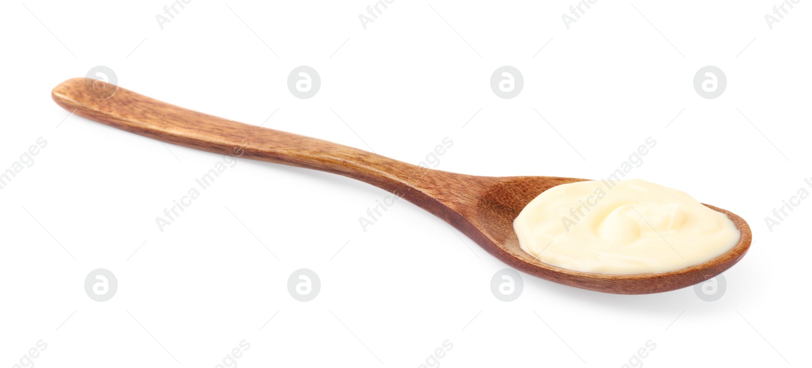 Photo of Mayonnaise in wooden spoon isolated on white