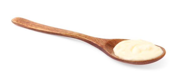 Photo of Mayonnaise in wooden spoon isolated on white