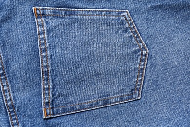 Photo of Light blue jeans with back pocket as background, closeup