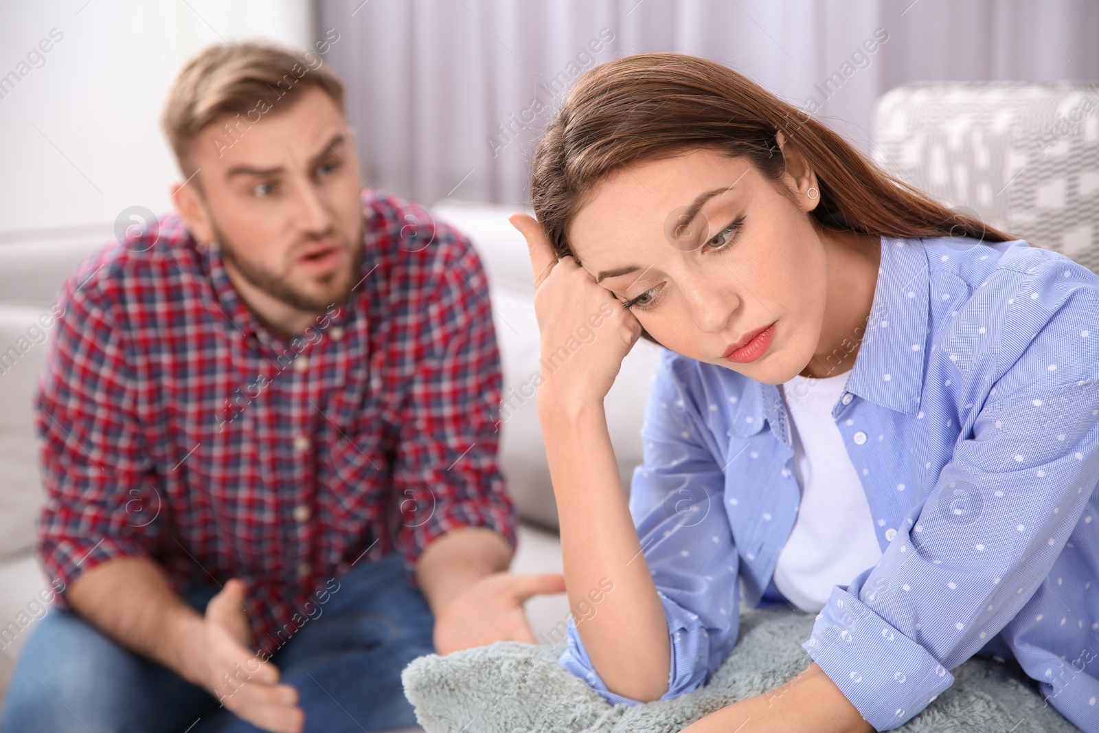 Photo of Couple having quarrel at home. Relationship problems