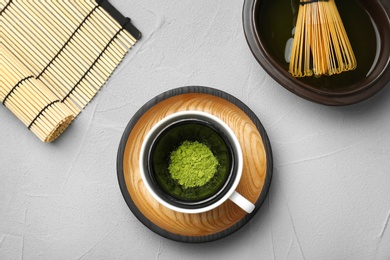 Flat lay composition with matcha tea on table