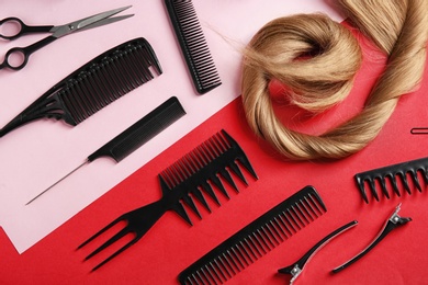 Photo of Flat lay composition with hair salon tools on color background