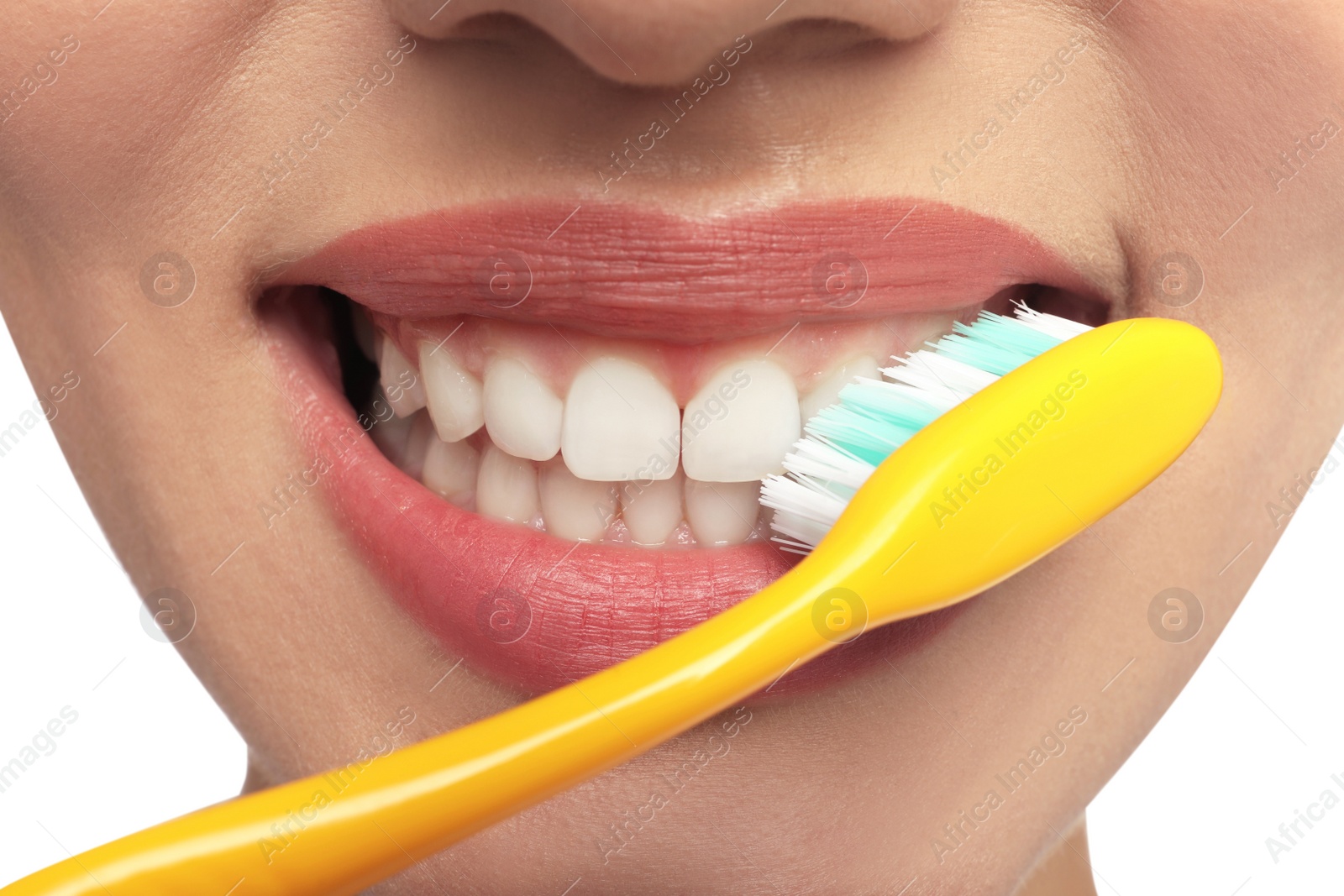 Photo of Woman brushing teeth on white background, closeup. Dental care