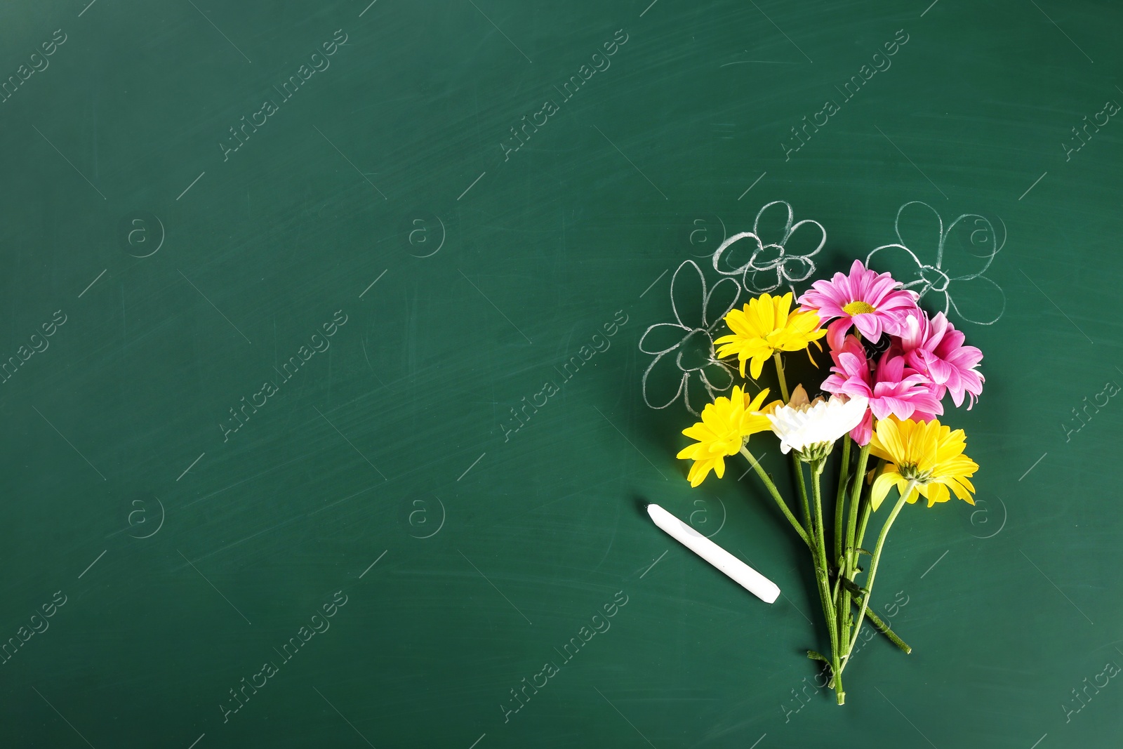 Photo of Flat lay composition for Teacher's day on chalkboard