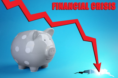 Piggy bank and chart on blue background. Coronavirus impact on global financial crisis