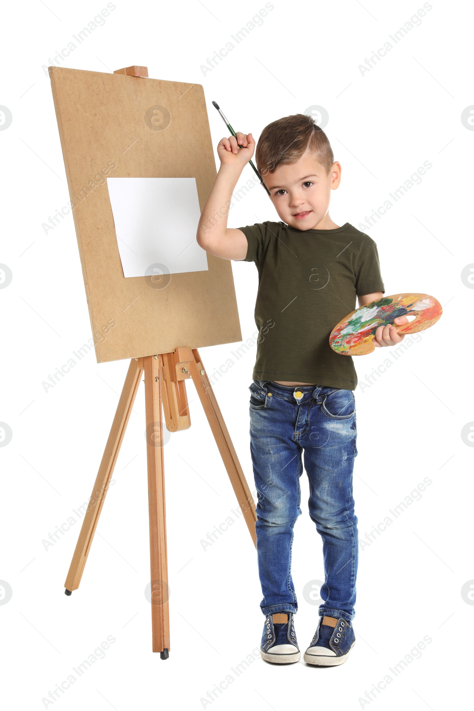 Photo of Child painting picture on easel against white background. Space for text