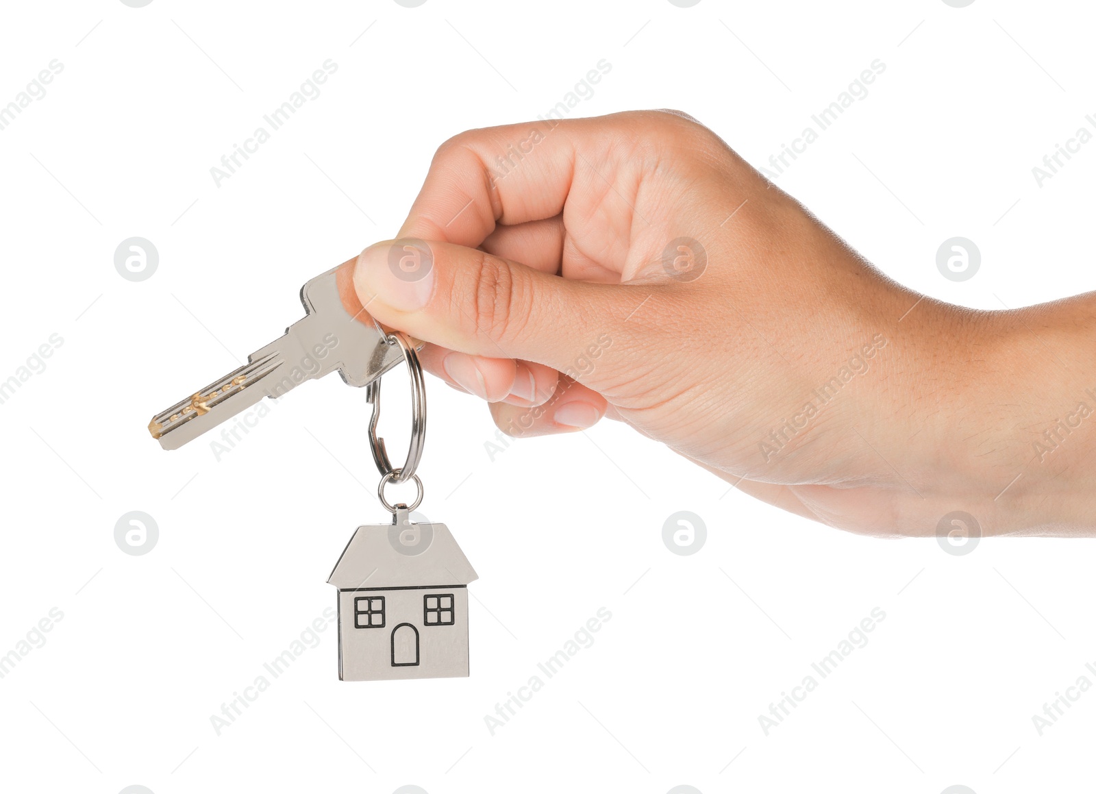 Photo of Woman holding key with metallic keychain in shape of house on white background, closeup