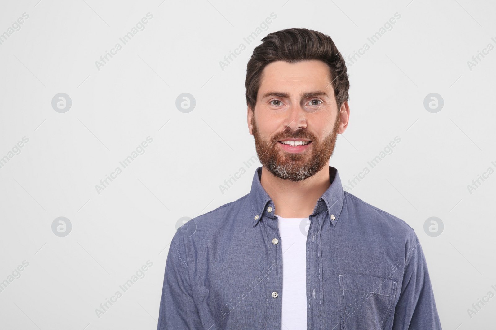 Photo of Portrait of handsome man on white background, space for text