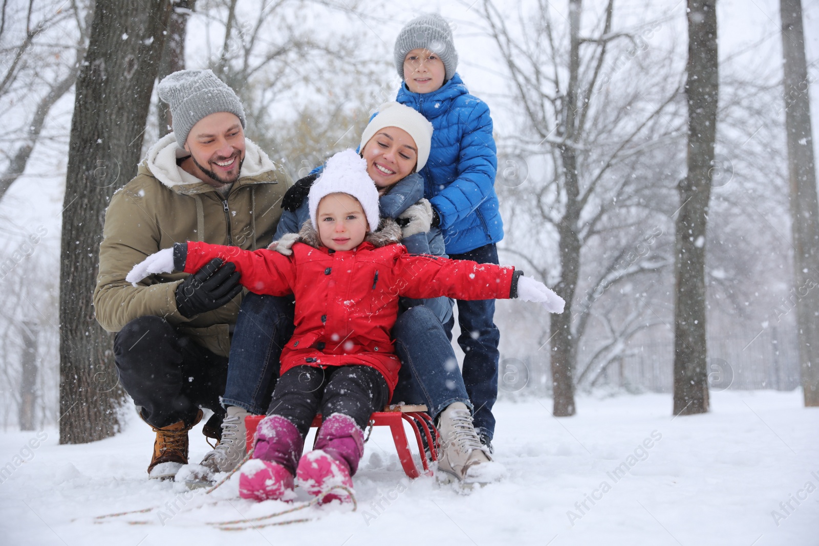 Photo of Portrait of happy family outside on winter day. Christmas vacation