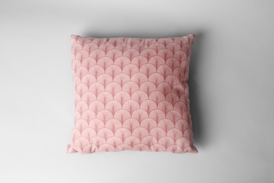 Soft decorative pillow on light background