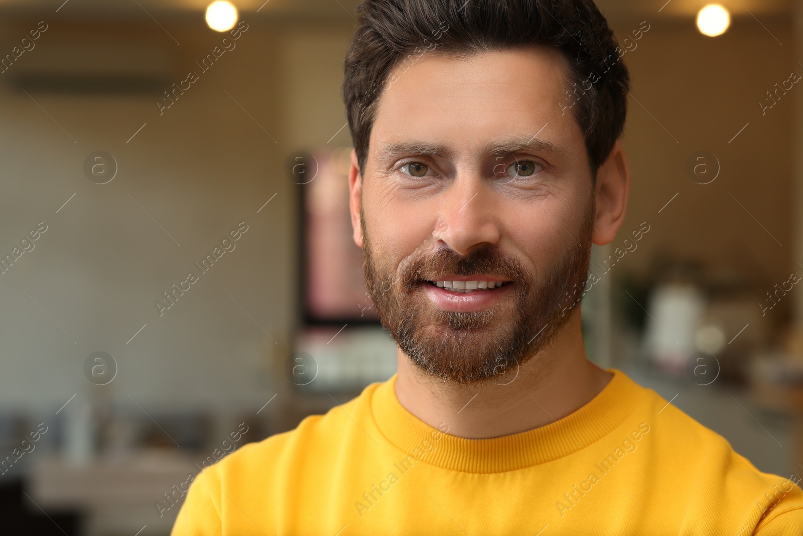 Photo of Portrait of handsome stylish man in office