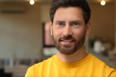 Photo of Portrait of handsome stylish man in office