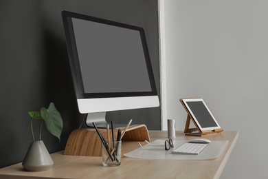 Modern workplace interior with computer on table. Space for text