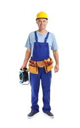 Electrician with extension cord reel and tools  wearing uniform on white background