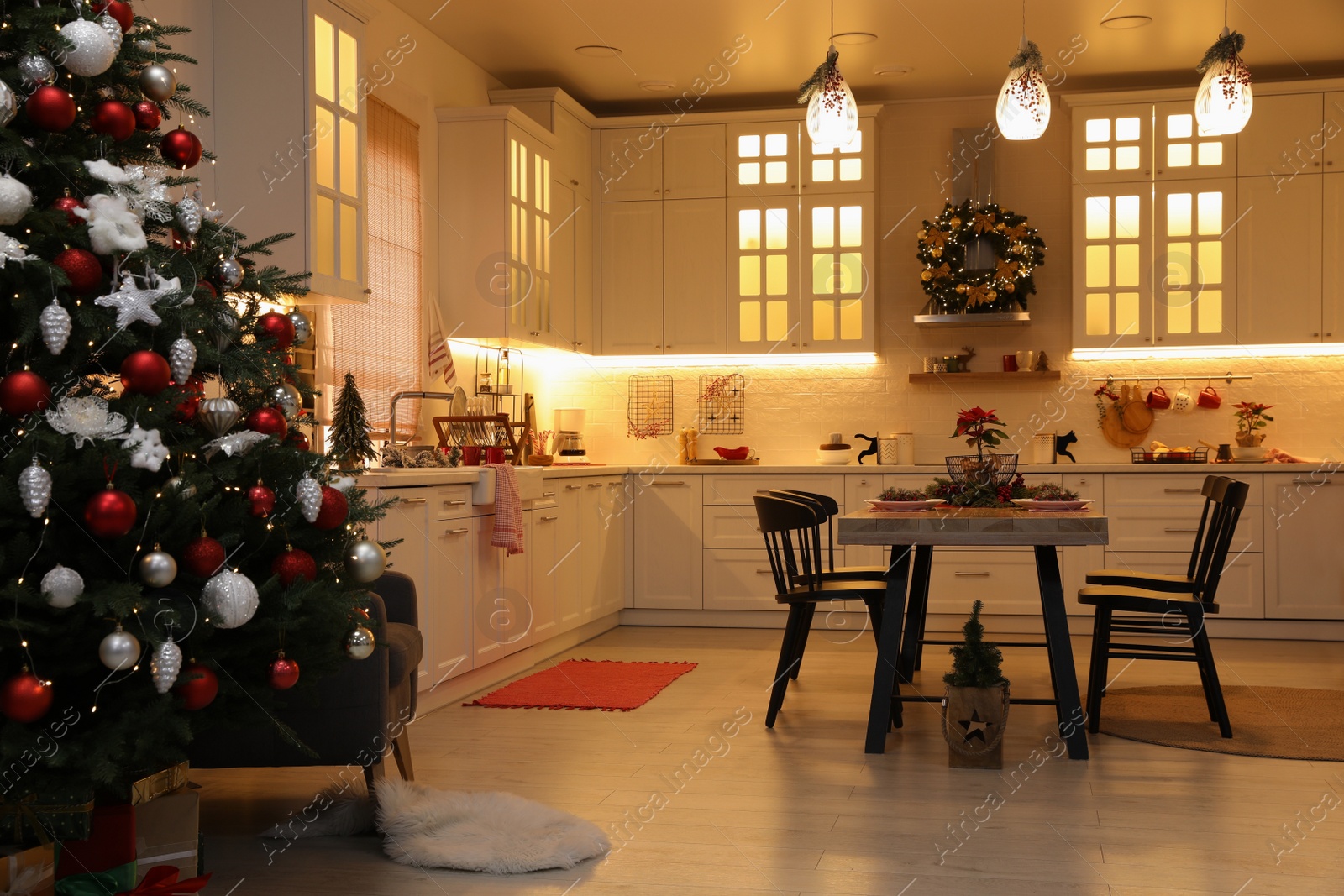 Photo of Cozy dining room interior with Christmas tree and beautiful festive decor