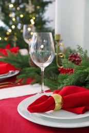 Beautiful table setting with Christmas decor indoors