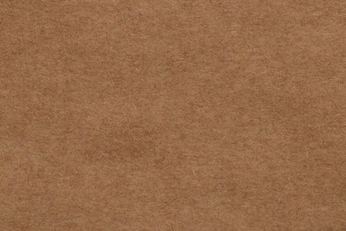 Photo of Texture of brown paper sheet as background, top view