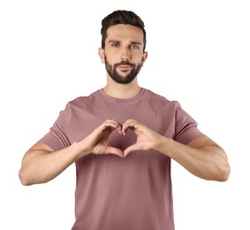 Photo of Man making heart with hands on white background