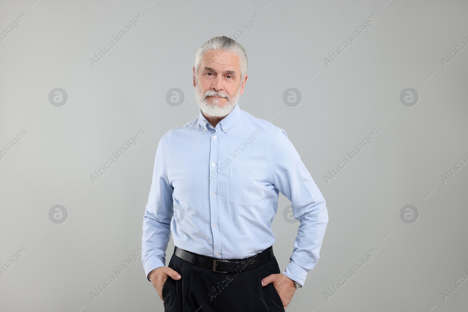 Photo of Portrait of handsome senior man on light grey background