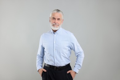 Photo of Portrait of handsome senior man on light grey background