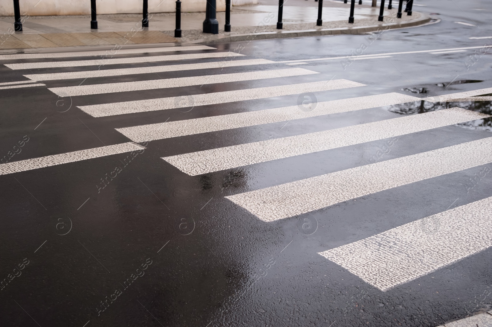 Photo of Pedestrian crossing in city outdoors after rain