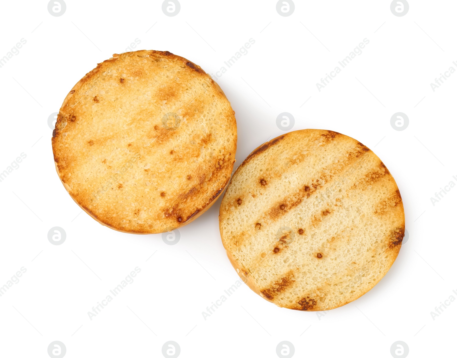 Photo of Halves of grilled burger bun isolated on white, top view