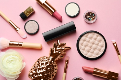 Photo of Flat lay composition with decorative cosmetics on color background