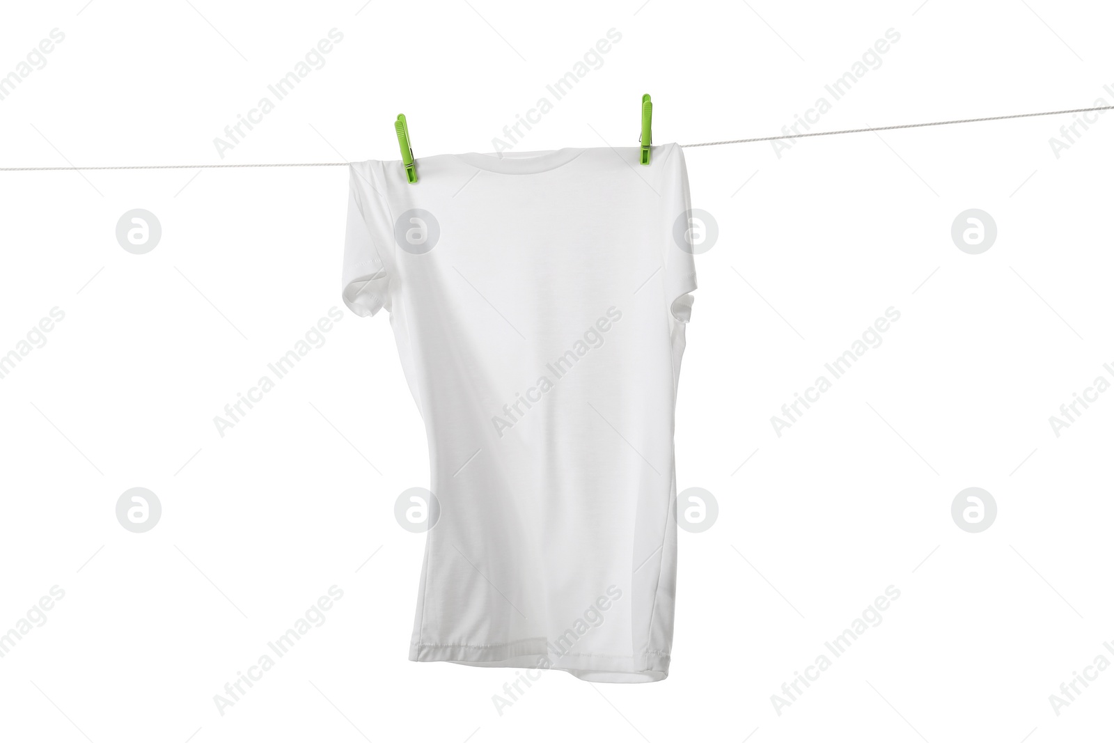 Photo of One t-shirt drying on washing line isolated on white