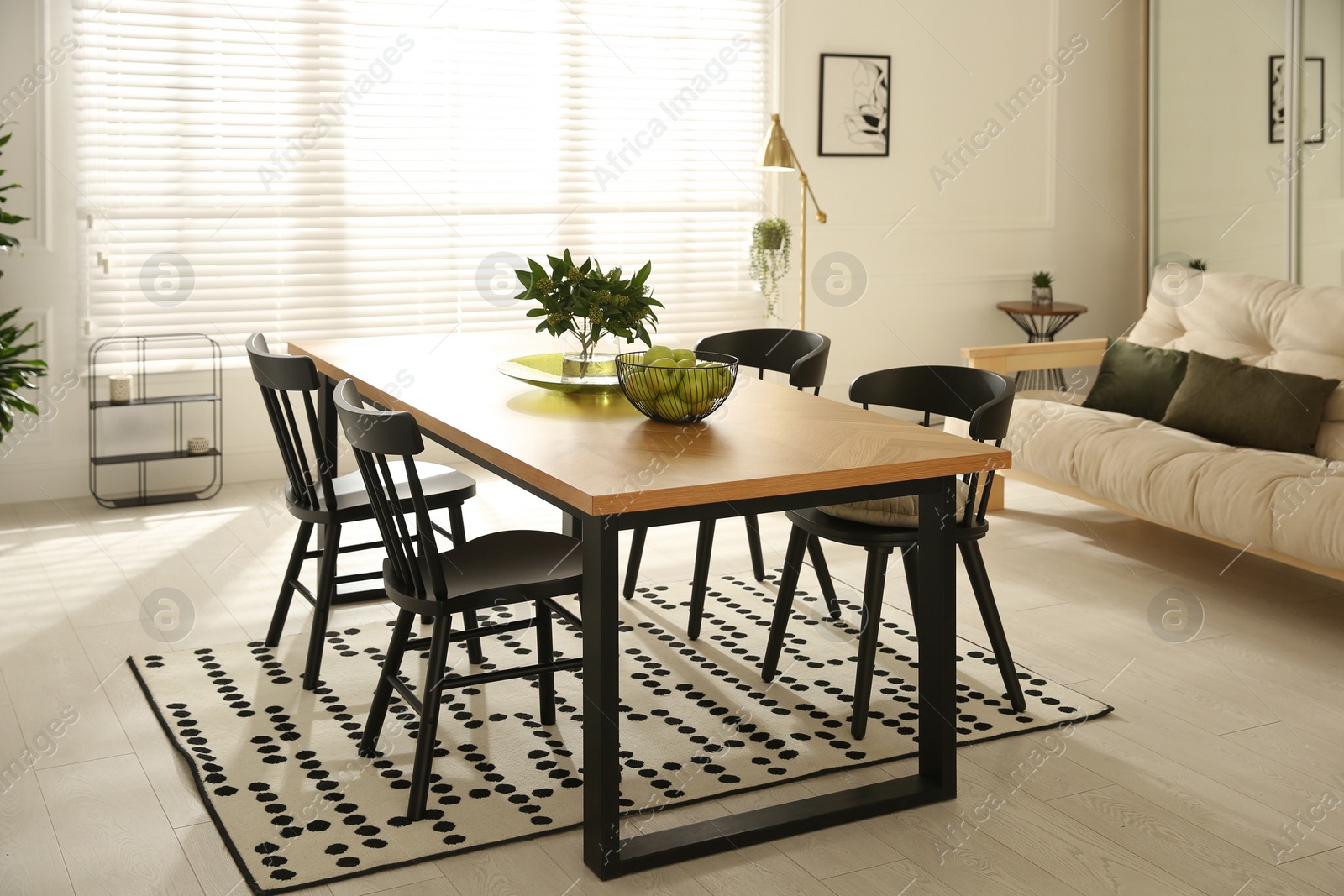 Photo of Stylish wooden dining table and chairs in room. Interior design