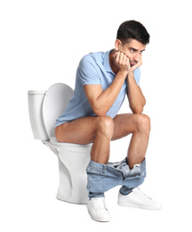 Photo of Man sitting on toilet bowl, white background