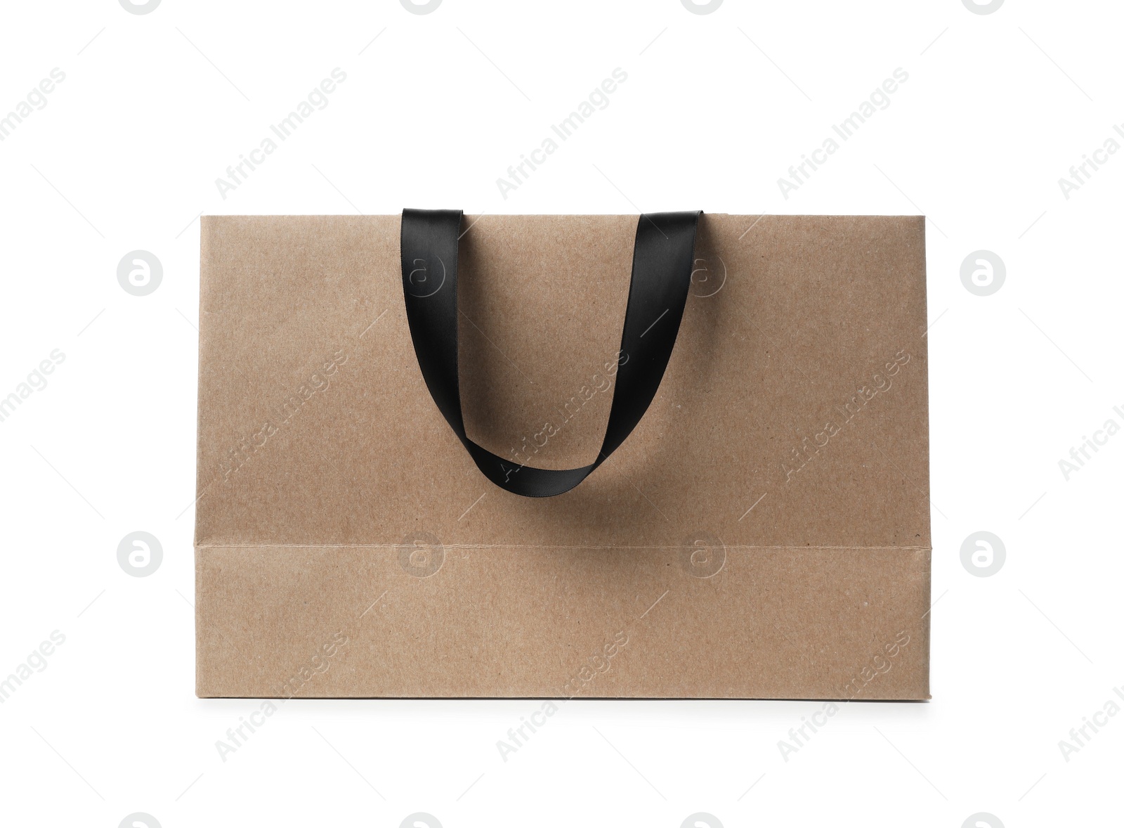 Photo of Paper shopping bag with ribbon handles on white background. Mockup for design