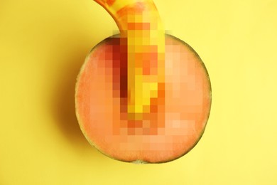 Fresh banana and melon on yellow background, top view. Sex concept