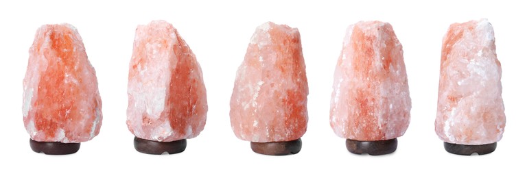Image of Set with pink Himalayan salt lamps on white background. Banner design 