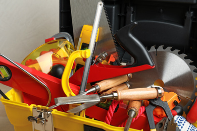 Box with different carpenter's tools, closeup view