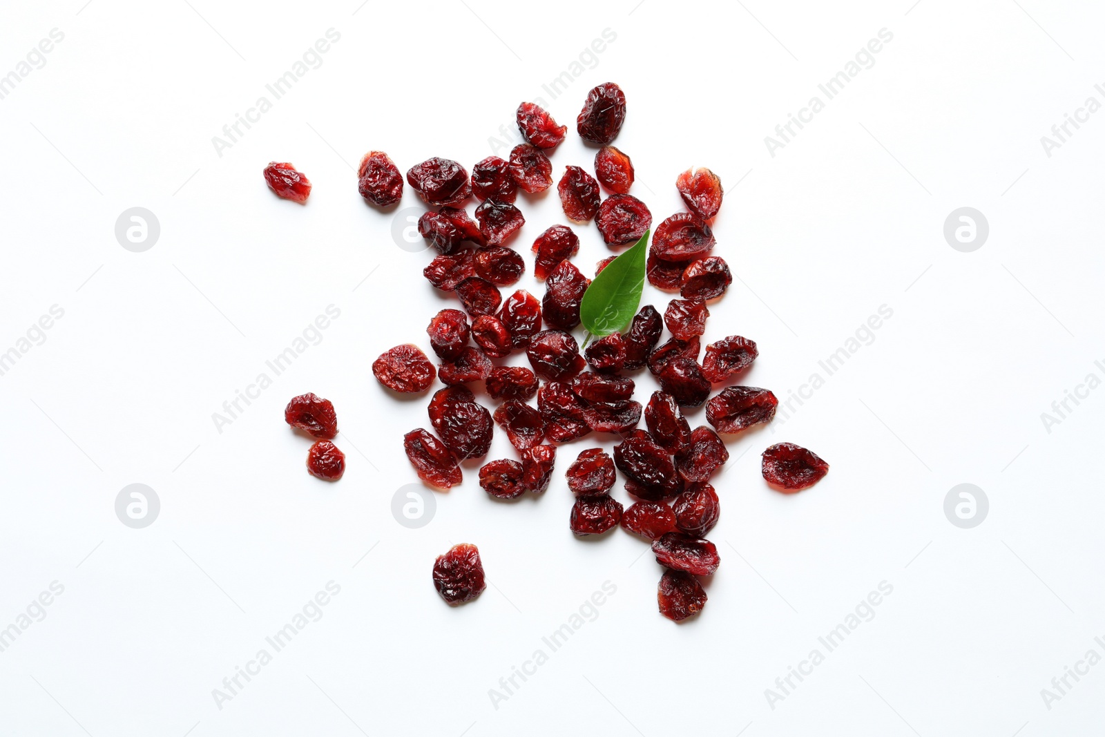 Photo of Cranberries on white background, top view. Dried fruit as healthy snack