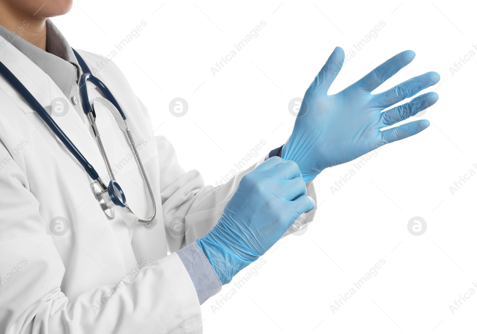 Photo of Doctor wearing light blue medical gloves on white background, closeup