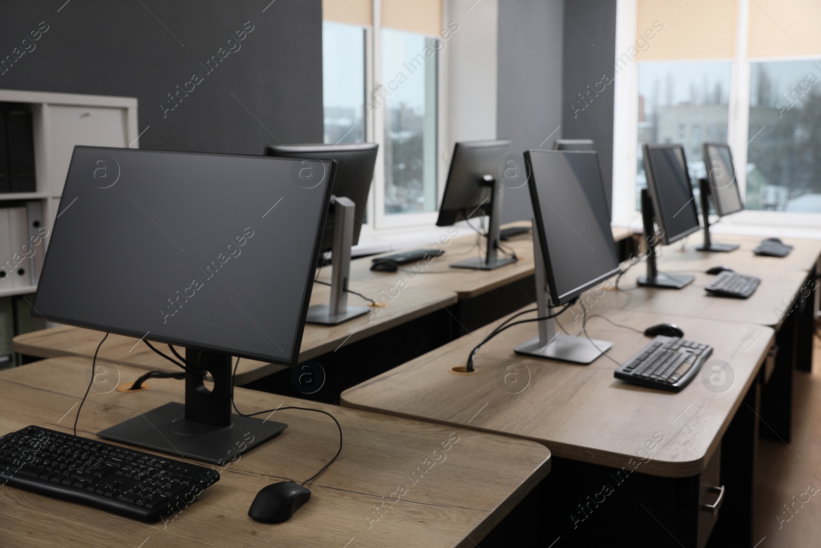 Photo of Many modern computers in open space office