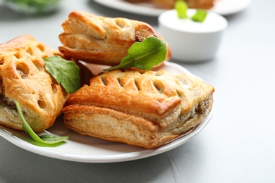 Fresh delicious puff pastry served on light table, closeup