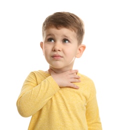 Cute boy suffering from cough on white background