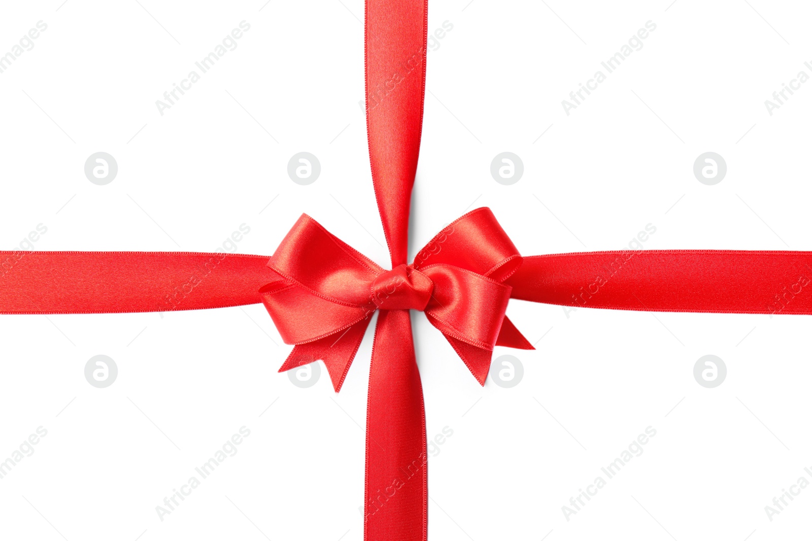 Photo of Red ribbon with bow on white background. Festive decoration