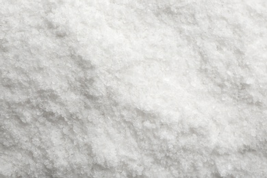 Natural white salt as background, top view