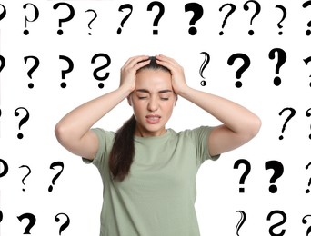 Image of Amnesia. Stressed young woman and question marks on white background