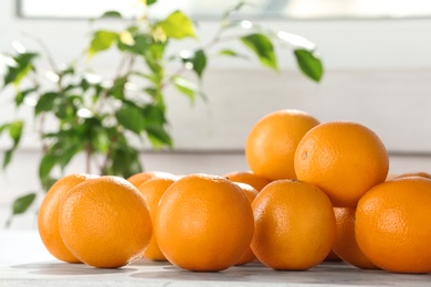 Photo of Fresh juicy oranges on table, space for text. Healthy fruits