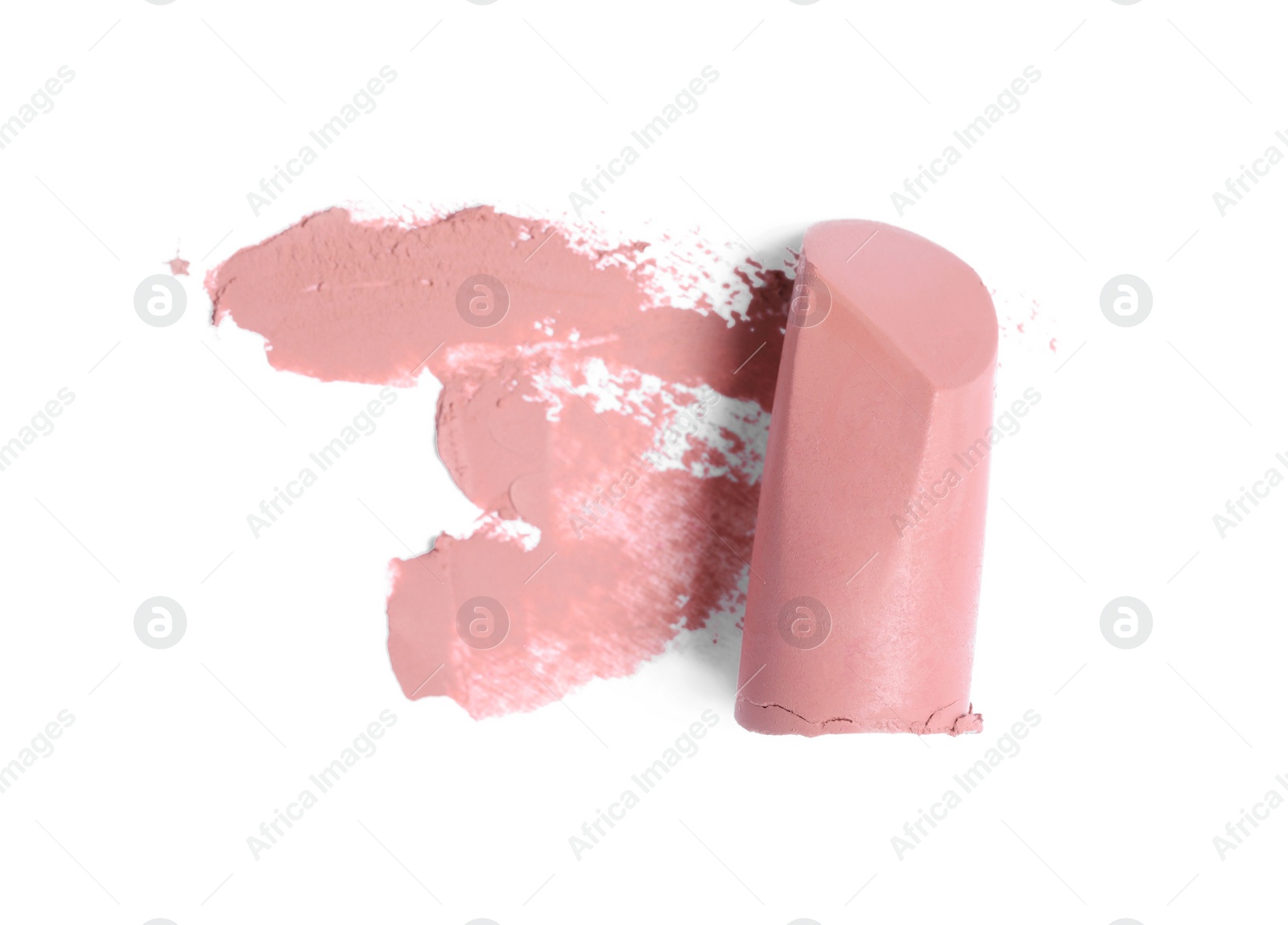 Photo of Nude color lipstick and smear on white background, top view